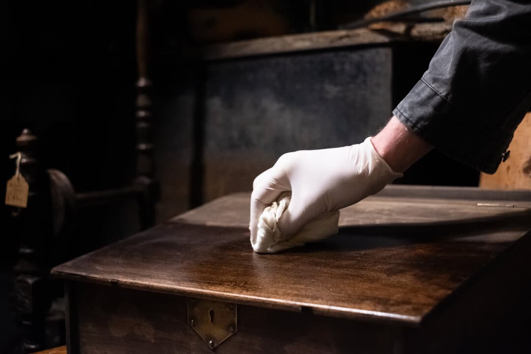 Rob at work polishing antique furniture