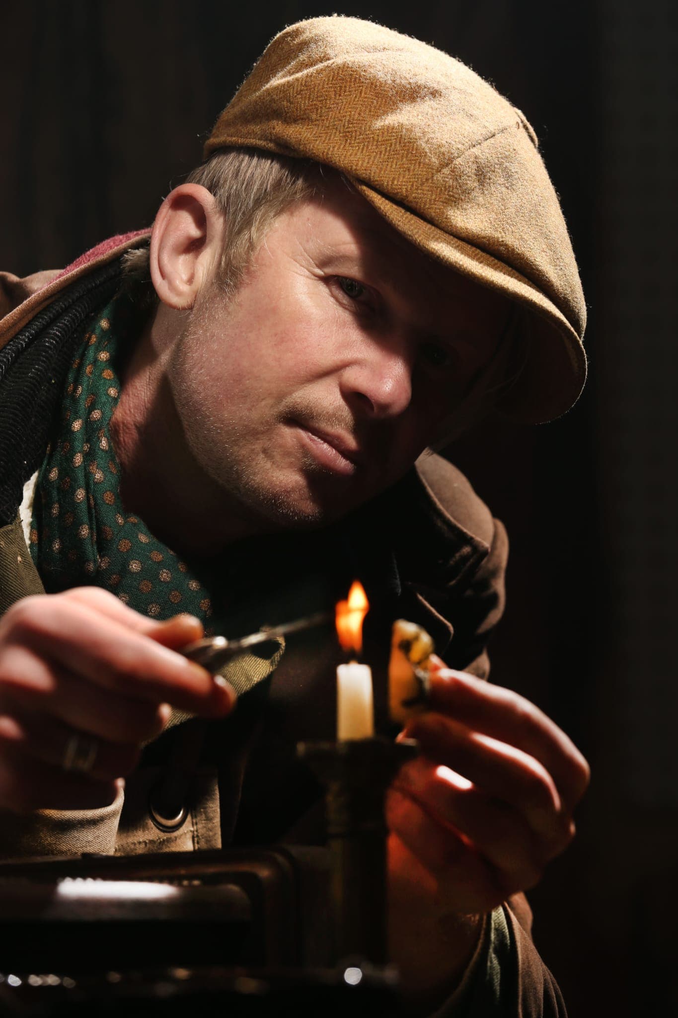 Rob Cain using traditional candle flame technique for precise restoration work
